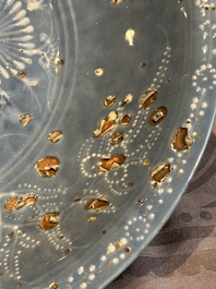 A Chinese Swatow slip-decorated blue-glazed 'chrysanthemum' dish and a turquoise- and black-enamelled 'dragon' dish, Ming
