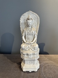 A Chinese Dehua blanc de Chine seated Guanyin, Qianlong mark, Republic