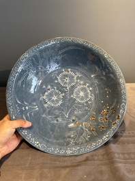 A Chinese Swatow slip-decorated blue-glazed 'chrysanthemum' dish and a turquoise- and black-enamelled 'dragon' dish, Ming