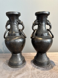A pair of Chinese bronze vases with 'dragon' handles, Yuan/Ming