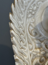 A Chinese Dehua blanc de Chine seated Guanyin, Qianlong mark, Republic