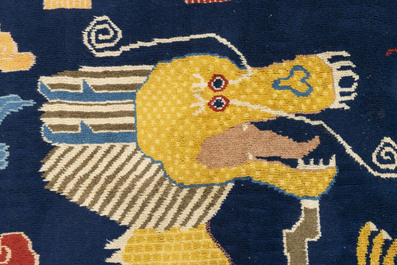 A Chinese inscribed woollen 'dragon' pillar carpet, 19th C.