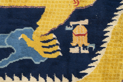 A Chinese inscribed woollen 'dragon' pillar carpet, 19th C.