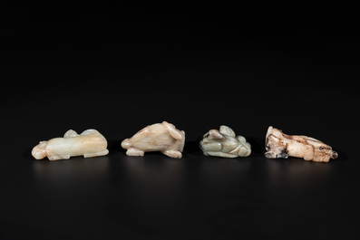 Five Chinese jade carvings with four wooden stands, 19th C.