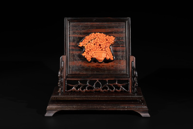 A Chinese silver-inlaid hardwood table screen with a red coral carving of a flower basket, 19/20th C.