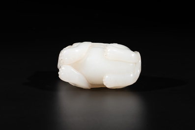 A Chinese white jade carving of a mythic animal, 19/20th C.