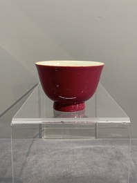 A fine Chinese ruby-ground famille rose 'magnolia' cup, Qianlong mark and of the period