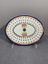 A Chinese export famille rose covered tureen and an oval dish with strainer, Jiaqing