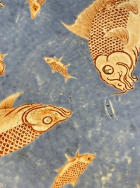A large Chinese iron-red-decorated blue-ground 'carps' dish, 19th C.