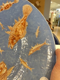 A large Chinese iron-red-decorated blue-ground 'carps' dish, 19th C.