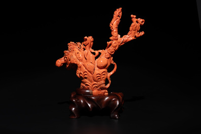 A Chinese red coral group of goddesses on wooden stand, 19/20th C.