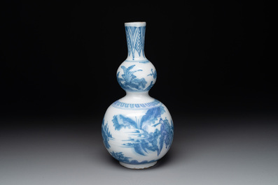 A blue and white Dutch Delft double gourd chinoiserie vase, 17th C.
