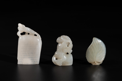 Three Chinese white and celadon jade carvings of a boy and two monkeys, 19th C.