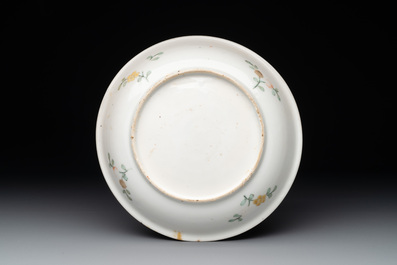 A Chinese wucai shipwreck plate with figures in a landscape, Wanli