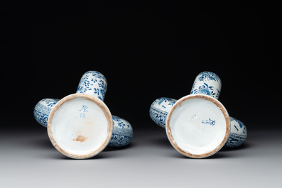 A pair of blue and white Dutch Delft circular jugs, 19th C.