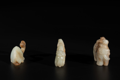 Three Chinese celadon and russet jade carvings of animals, 19th C.