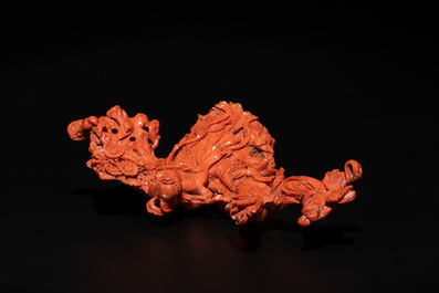 A Chinese red coral group of goddesses on wooden stand, 19/20th C.