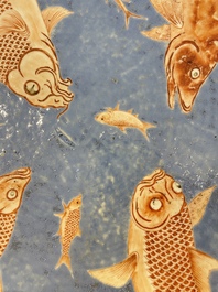 A large Chinese iron-red-decorated blue-ground 'carps' dish, 19th C.