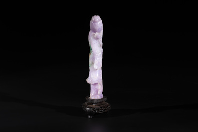 A Chinese lavender- and mint-green-jade figure of a goddess holding a sceptre and fan on wooden stand, 19th C.