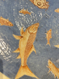 A large Chinese iron-red-decorated blue-ground 'carps' dish, 19th C.