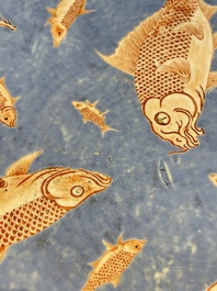 A large Chinese iron-red-decorated blue-ground 'carps' dish, 19th C.