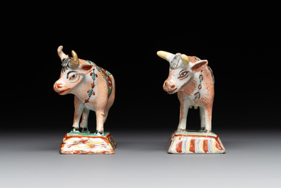 Four polychrome and petit feu Dutch Delft cows, 18th C.