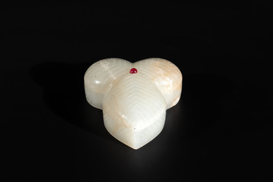 A Chinese Mughal-style leaf-shaped ruby-inset jade box and cover on wooden base, 18th C.