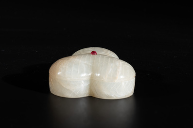 A Chinese Mughal-style leaf-shaped ruby-inset jade box and cover on wooden base, 18th C.