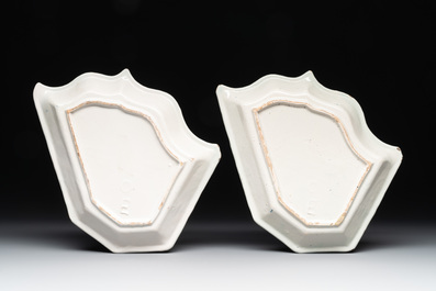 Four fine blue and white Dutch Delft leaf-shaped dishes with travellers in a landscape, early 18th C.
