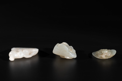 Three Chinese white and celadon jade carvings of a boy and two monkeys, 19th C.