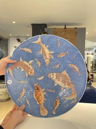 A large Chinese iron-red-decorated blue-ground 'carps' dish, 19th C.
