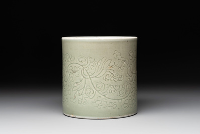 A Chinese incised celadon-glazed 'lotus scroll' brush pot, Kangxi