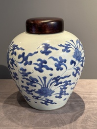 A Chinese blue and white 'lotus scroll' vase with wooden cover, Kangxi