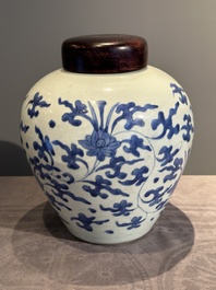 A Chinese blue and white 'lotus scroll' vase with wooden cover, Kangxi