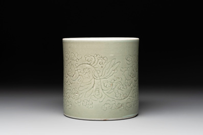 A Chinese incised celadon-glazed 'lotus scroll' brush pot, Kangxi