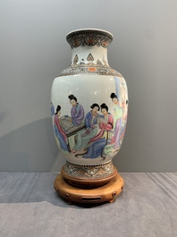A Chinese famille rose vase with ladies on wooden stand, Qianlong mark, Republic
