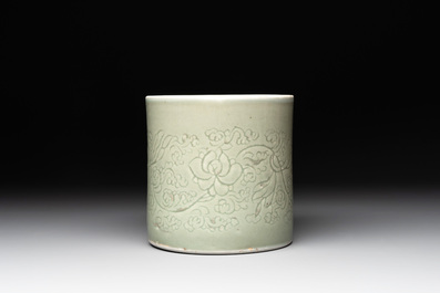 A Chinese incised celadon-glazed 'lotus scroll' brush pot, Kangxi
