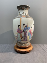 A Chinese famille rose vase with ladies on wooden stand, Qianlong mark, Republic