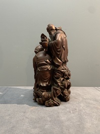 A Chinese carved wooden 'Fu Lu Shou' group, 19/20th C.