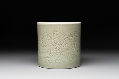 A Chinese incised celadon-glazed 'lotus scroll' brush pot, Kangxi