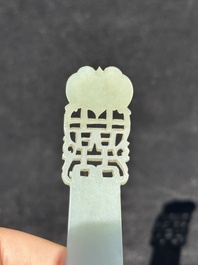 A Chinese pale celadon jade 'double happiness' hairpin on a ruyi-shaped wooden stand, 19th C.