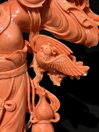 A Chinese red coral Xiwangmu on wooden stand, 19/20th C.
