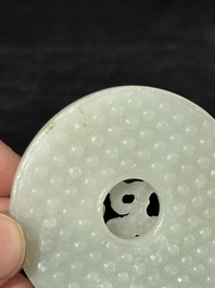 A Chinese white jade 'chilong' 'bi' disc, Qing