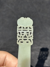 A Chinese pale celadon jade 'double happiness' hairpin on a ruyi-shaped wooden stand, 19th C.