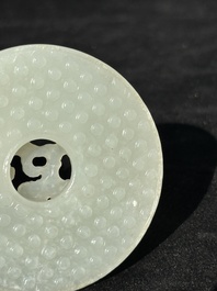 A Chinese white jade 'chilong' 'bi' disc, Qing