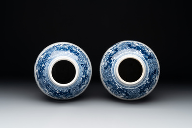 A pair of Chinese blue and white vases with floral design, Qianlong