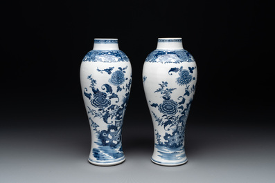 A pair of Chinese blue and white vases with floral design, Qianlong