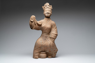 A large Chinese terracotta sculpture of a dancer, possibly Han