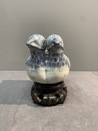 A Chinese blue and white 'double mandarin duck' ewer or water dropper on wooden stand, Ming, ca. 1500