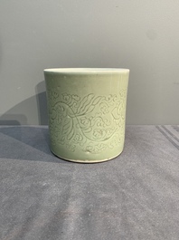 A Chinese incised celadon-glazed 'lotus scroll' brush pot, Kangxi